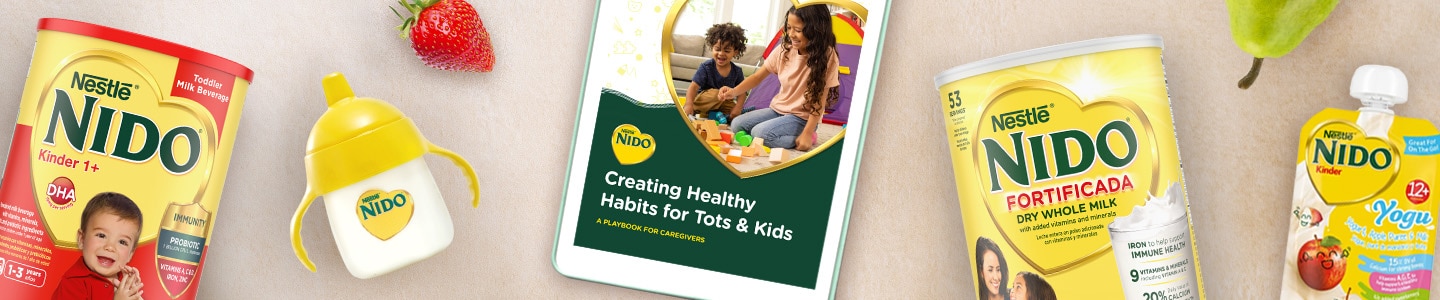 Nido eBook on a tablet next to Nido bottles, products, and fruits on a beige surface.