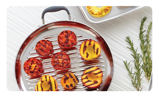 Grilled tomatoes and peaches on a Royal Prestige griddle.